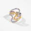 Mixed metal two-tone wavy ring gold and silver contrast band.