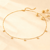 Luminova Dainty Gold Drop Necklace with a teardrop pendant, isolated on a white background.