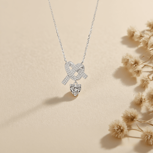 Lovebound Heart Moissanite Necklace — heart shaped moissanite pendant in sterling silver on delicate chain, romantic and luminous.
