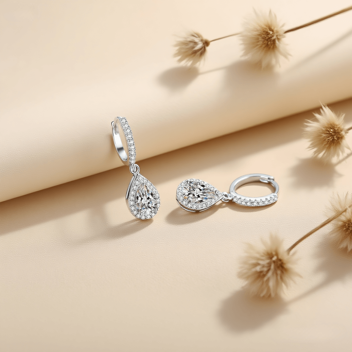 Luminous Drop Moissanite Earrings — teardrop moissanite stud earrings in sterling silver, graceful and radiant.