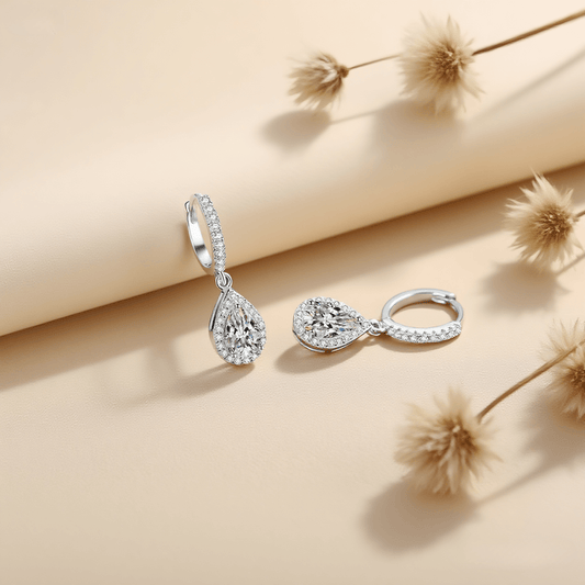 Luminous Drop Moissanite Earrings — teardrop moissanite stud earrings in sterling silver, graceful and radiant.