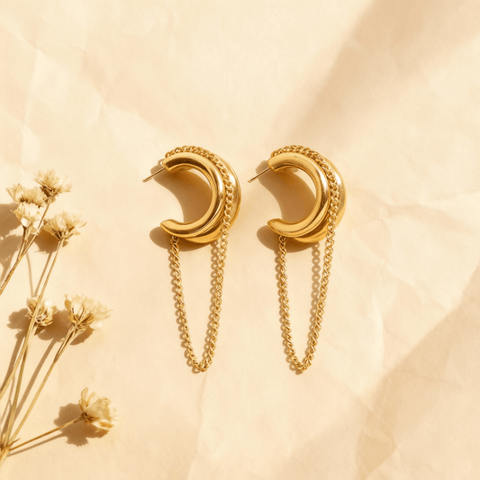Luxe Layered Chain Hoops in 18K gold featuring a triple-stacked chunky C-shape design with a hanging curb chain on a white background.