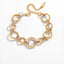 Mixed metal interlocking link bracelet two-tone gold and silver waterproof stainless steel.