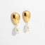 Pair of sculptural gold and white pearl drop earrings, waterproof stainless steel jewelry.