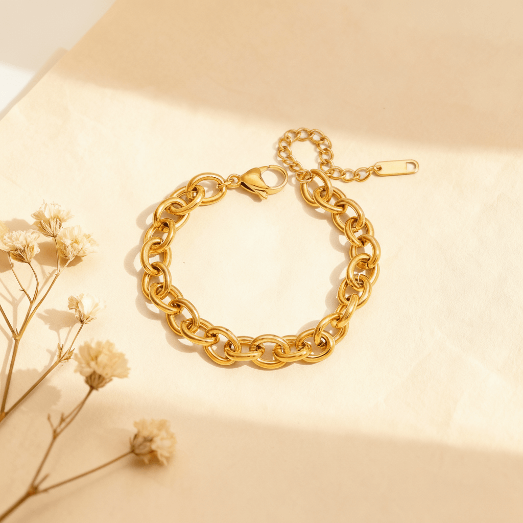 Product shot of the bold toggle clasp bracelet from The Amalfi Layering Set, styled with delicate dried flowers in warm, natural sunlight.