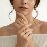 Model wearing the adjustable Seraphina Ring in all-gold on her index finger, paired with another delicate ring to show its layering potential.
