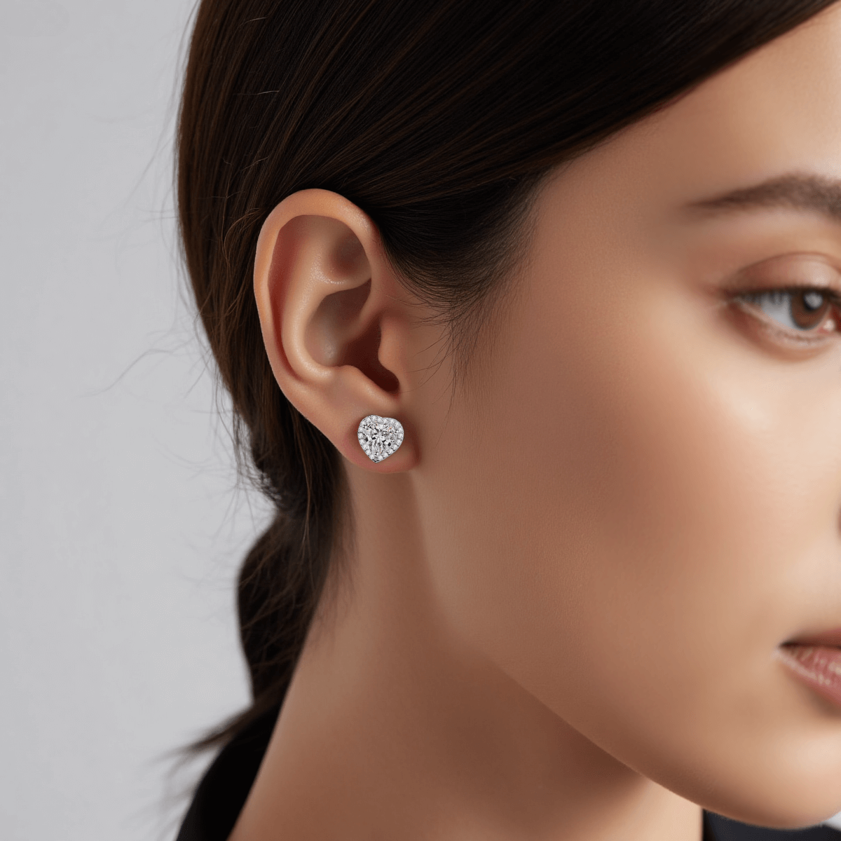 Gleaming Heart Moissanite Earrings — sterling silver heart-shaped stud earrings with sparkling moissanite, romantic and elegant gift.