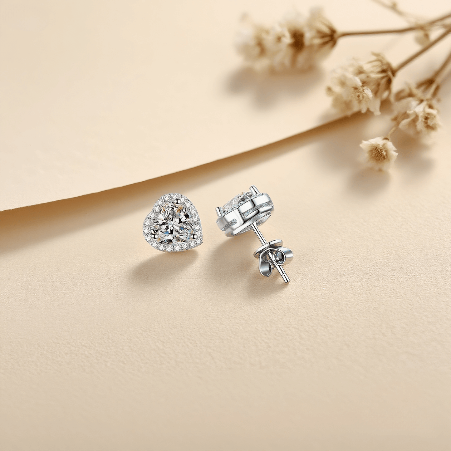 Gleaming Heart Moissanite Earrings — sterling silver heart-shaped stud earrings with sparkling moissanite, romantic and elegant gift.