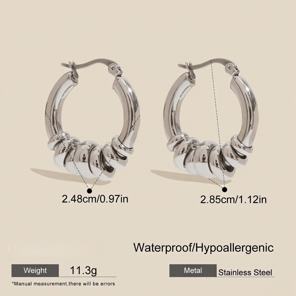 A pair of two tone Siena Stacked Hoops, highlighting the textural, multi-ring design and high-shine 18K gold-painted and polished finish.