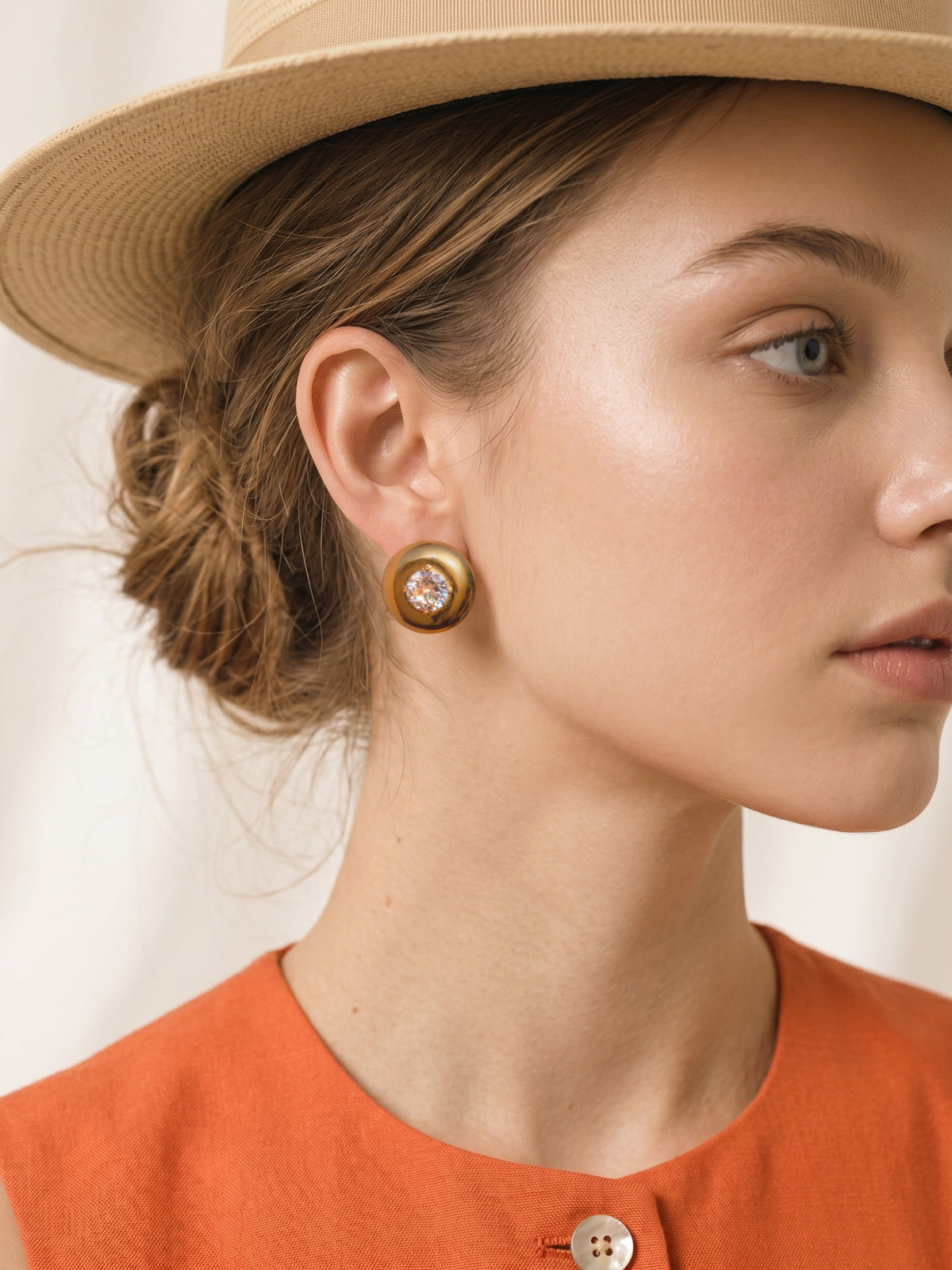 Vesta Bold Dome Studs styled on the ear, highlighting the chunky rounded dome silhouette and cubic zirconia center