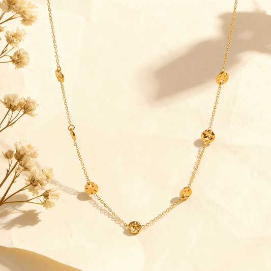 Luminova Dainty Bezel Station Gold Necklace with an empty setting, isolated on a white gold background.