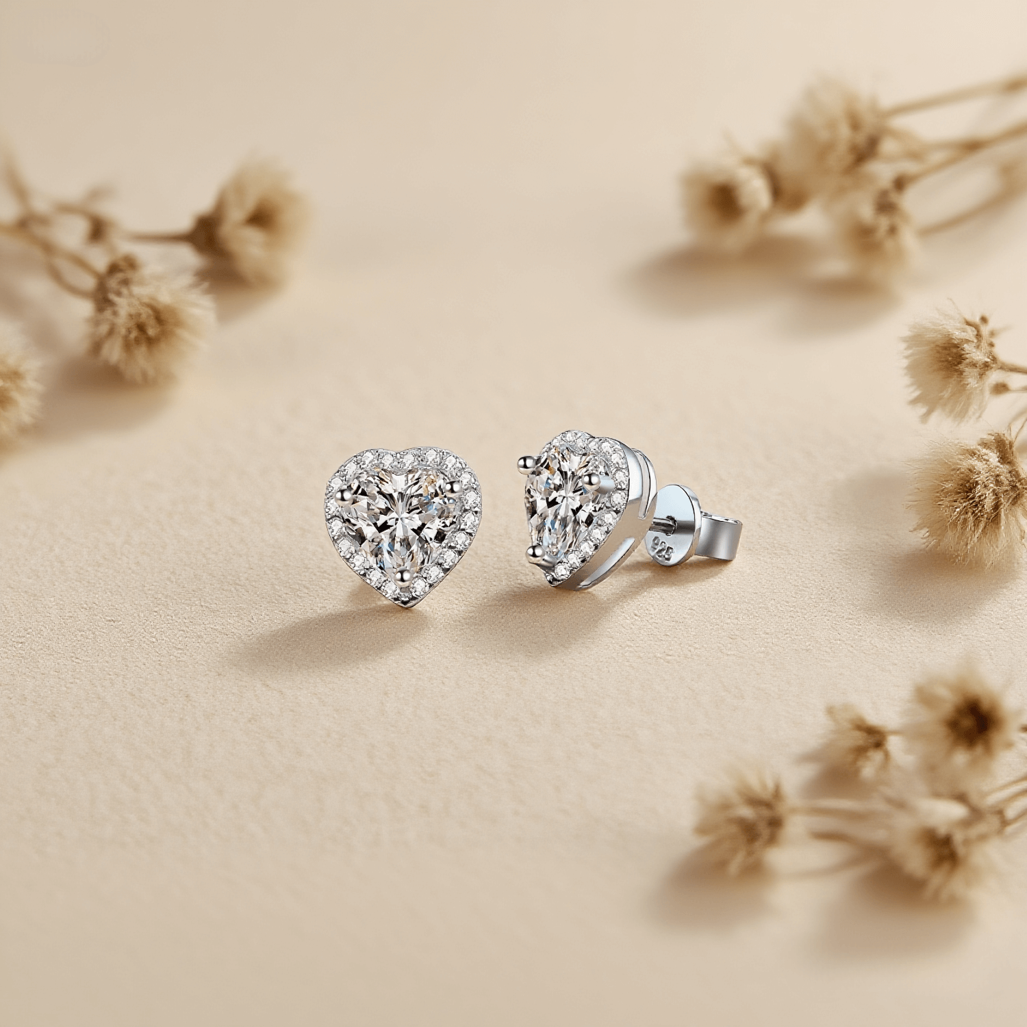 Gleaming Heart Moissanite Earrings — heart-shaped moissanite stud earrings in sterling silver, symbolic and beautiful gift.