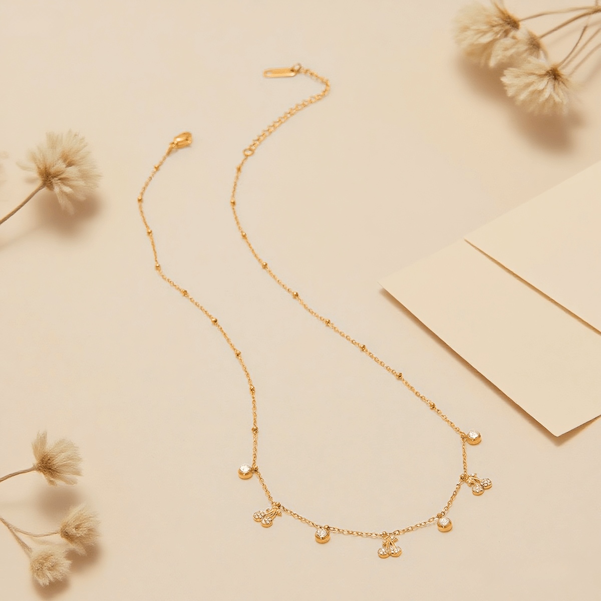 Golden Dew Necklace — delicate gold dew-drop pendant on extender chain, romantic and luminous accessory.