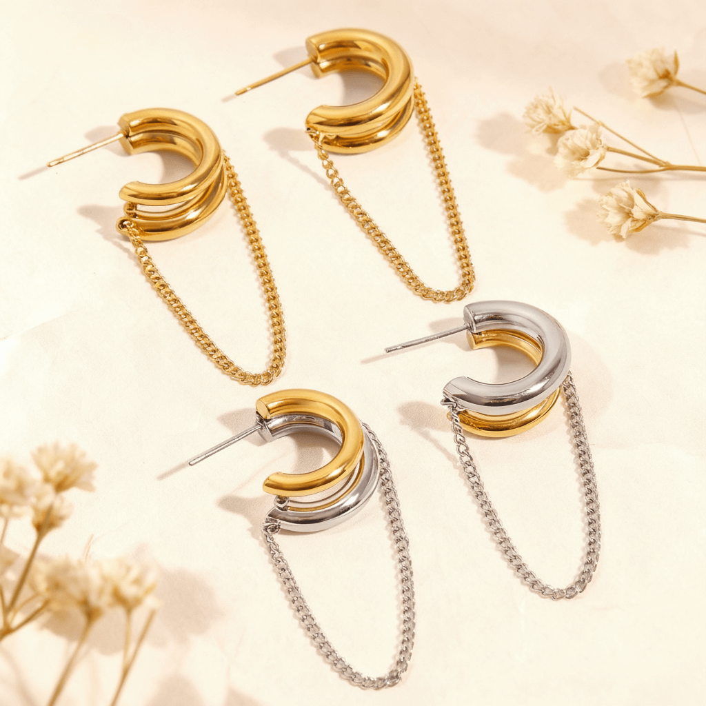 Two pairs of the Luxe Layered Chain Hoops, one in all-gold and one in two-tone gold and silver, are displayed together.