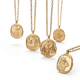 Collection of organic wax seal zodiac necklaces with matte gold finish and luxury box chains.