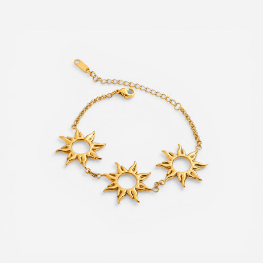 Gold chain bracelet with three sunburst charms waterproof stainless steel.