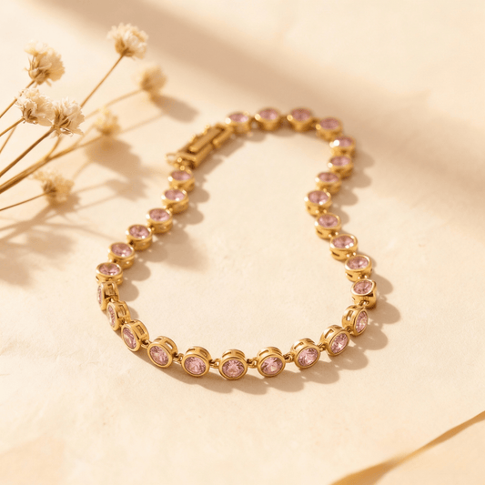 Sweetheart Pink Tennis Bracelet featuring round pink crystals in an 18k gold plated bezel setting, shown on a clean white background.