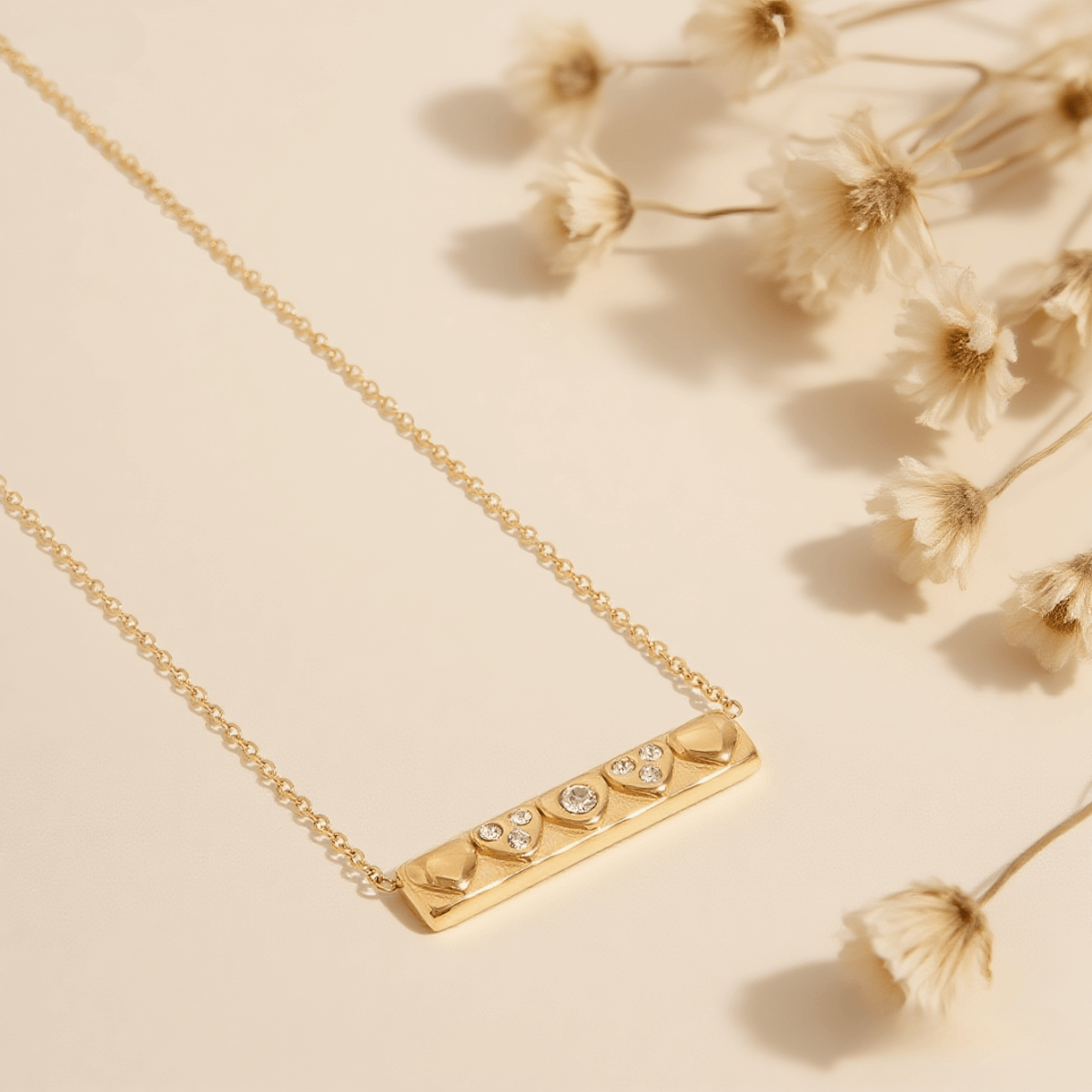 Heartline Bar Necklace — gold bar pendant with heart-shape detailing and stones, romantic and sleek.