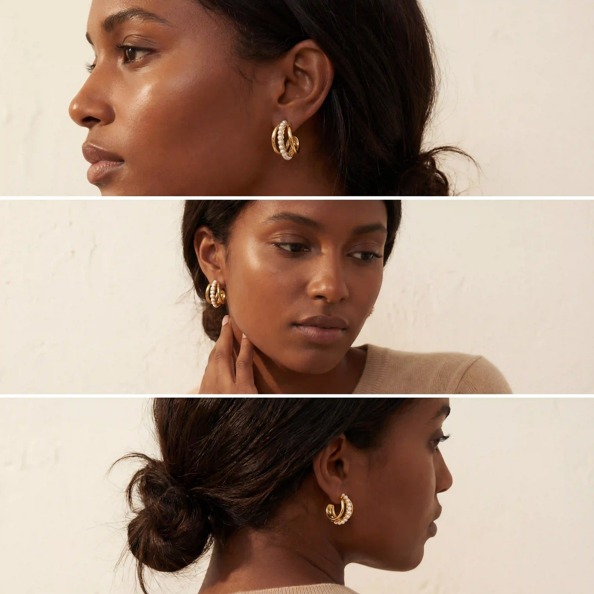 Model with dark skin wearing gold Siren hoops with pearls statement earrings.