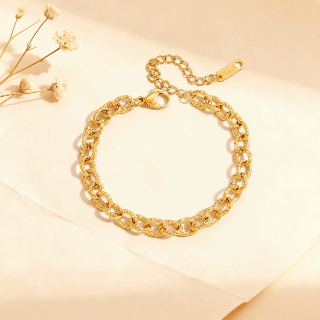 Close-up of the unique love knot chain bracelet from The Amalfi Layering Set, formed into a circle to highlight its intricate details.