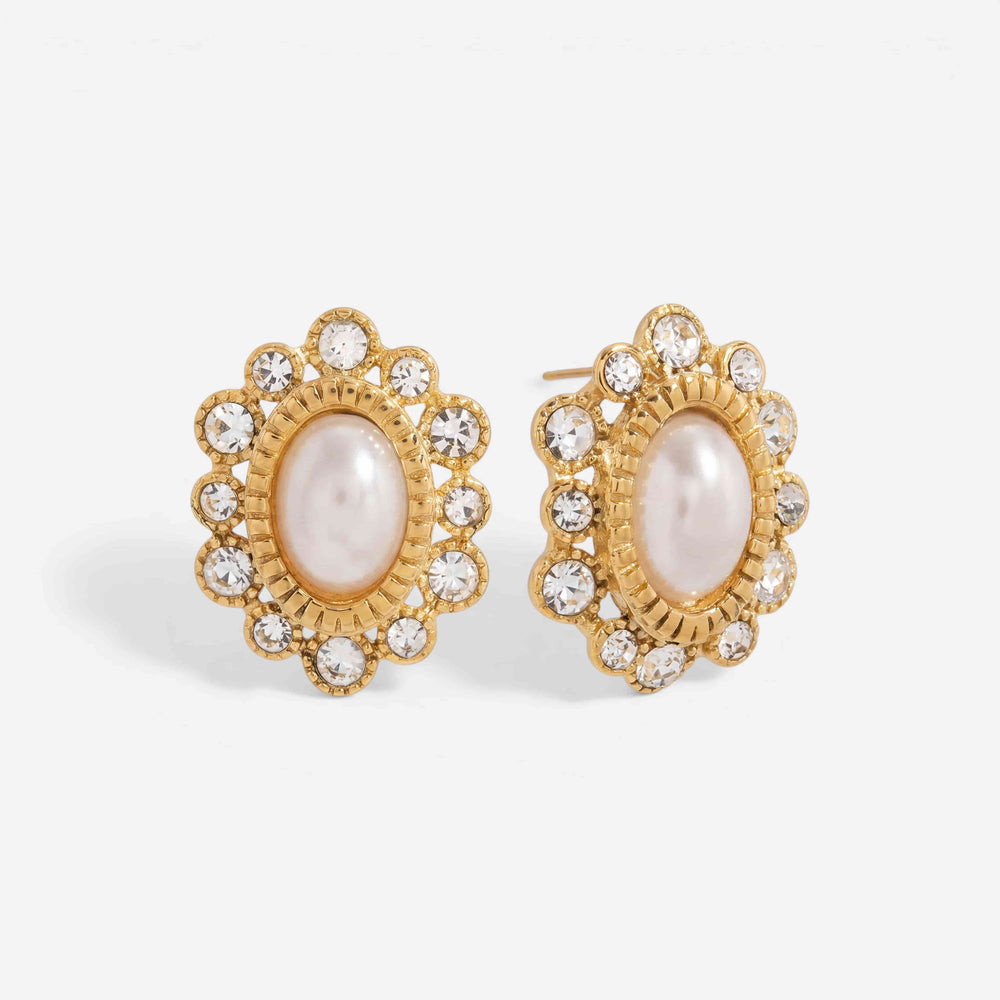 Pair of oval pearl stud earrings with crystal sunburst halo waterproof gold jewelry.
