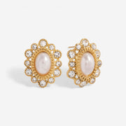 Pair of oval pearl stud earrings with crystal sunburst halo waterproof gold jewelry.