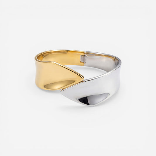 Sculptural two-tone open cuff bracelet modern design stainless steel.