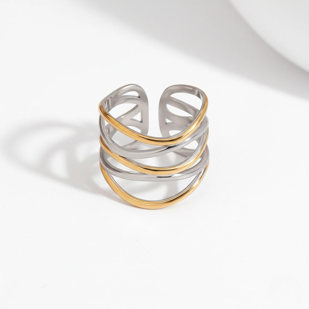Mixed metal two-tone ring gold and silver crossover design wide band.