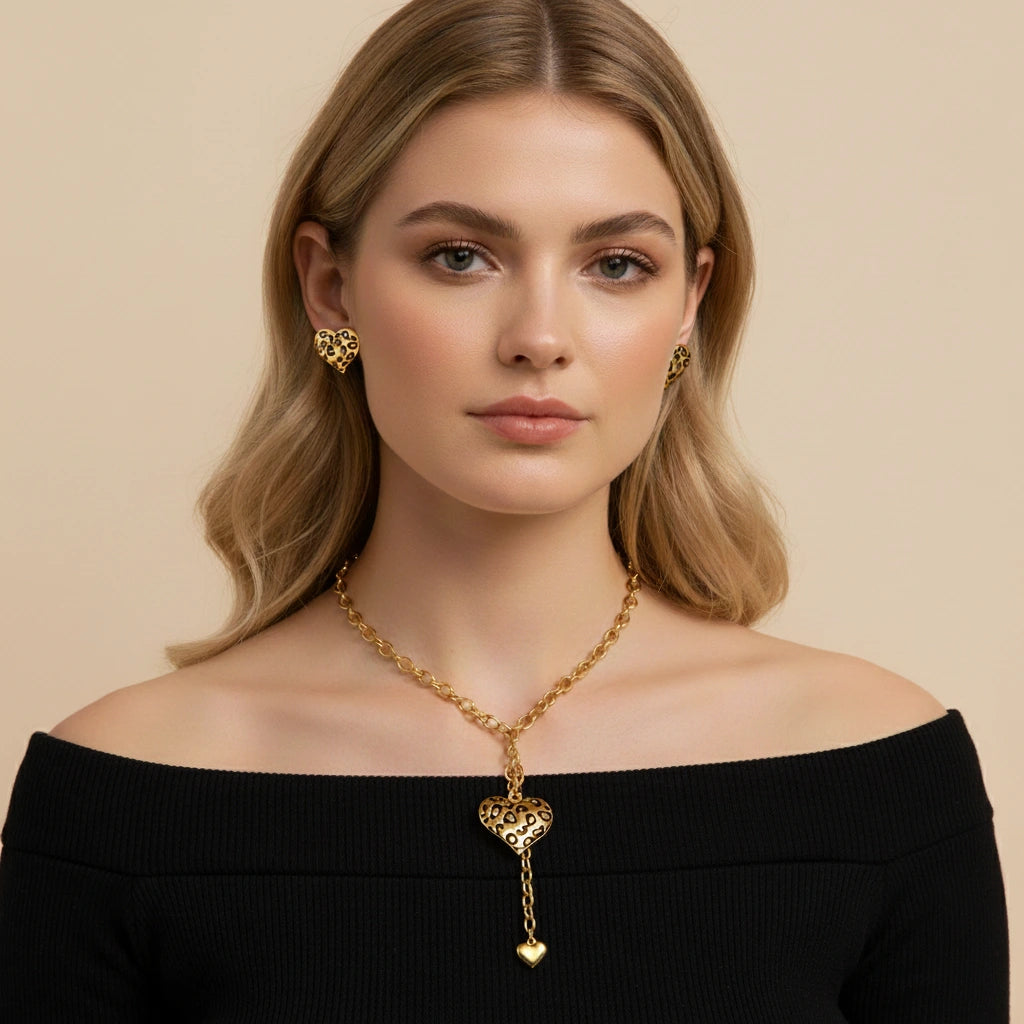 A model in a chic off-the-shoulder top, where The Artemis Lariat acts as the perfect bold centerpiece, drawing attention to the neckline.