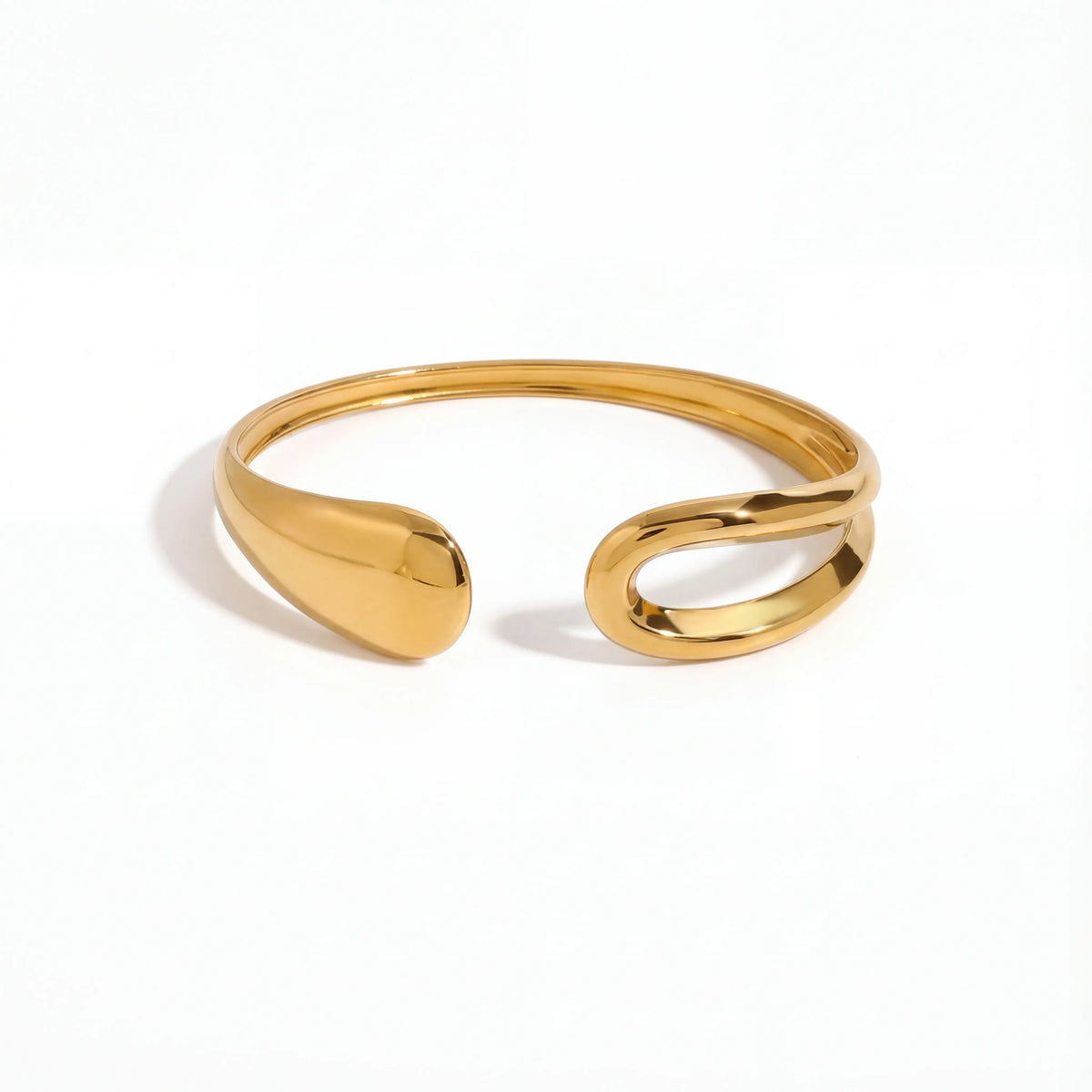Asymmetrical teardrop open cuff bracelet gold stainless steel liquid metal design.