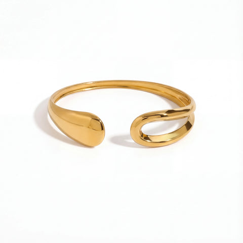 Asymmetrical teardrop open cuff bracelet gold stainless steel liquid metal design.