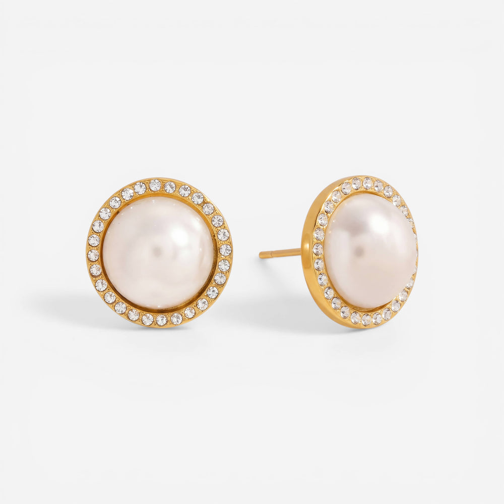 Pair of gold rimmed pearl stud earrings with cubic zirconia halo waterproof jewelry.