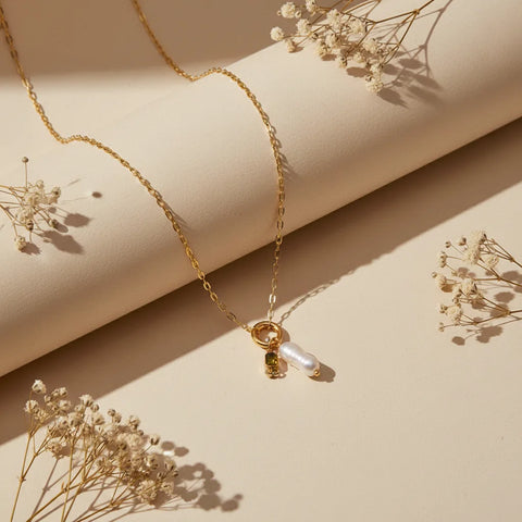 The August birthstone (peridot green) version of The Astoria Necklace, showcasing the bright, olive-green gem for a unique look.