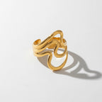 Gold wavy open ring with abstract ripple design waterproof stainless steel.