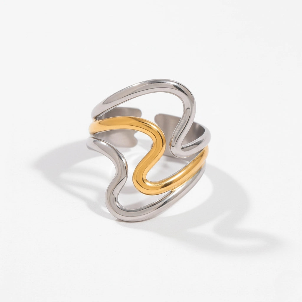 Mixed metal two-tone wavy ring gold and silver contrast band.