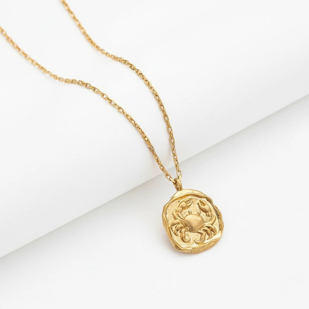 Cancer crab zodiac sign gold coin necklace matte finish irregular shape.