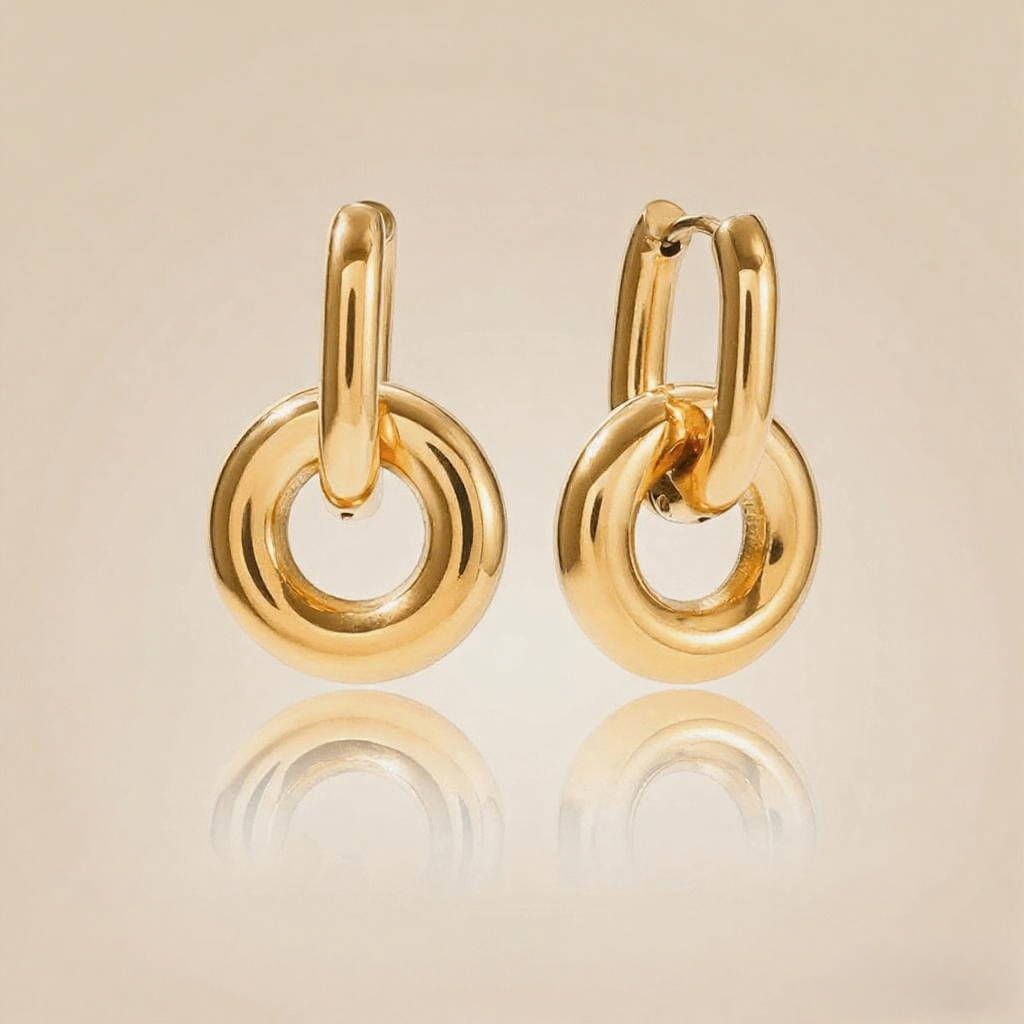 Close-up detail of the 3D twist knot and luxurious gold plating on Luminova's hoop earrings.