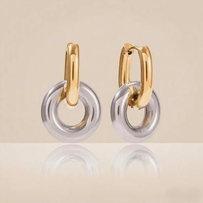 Close-up detail of the 3D twist knot and luxurious gold plating on Luminova's hoop earrings.
