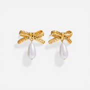 Pair of gold ribbon bow earrings with pearl drop waterproof stainless steel.