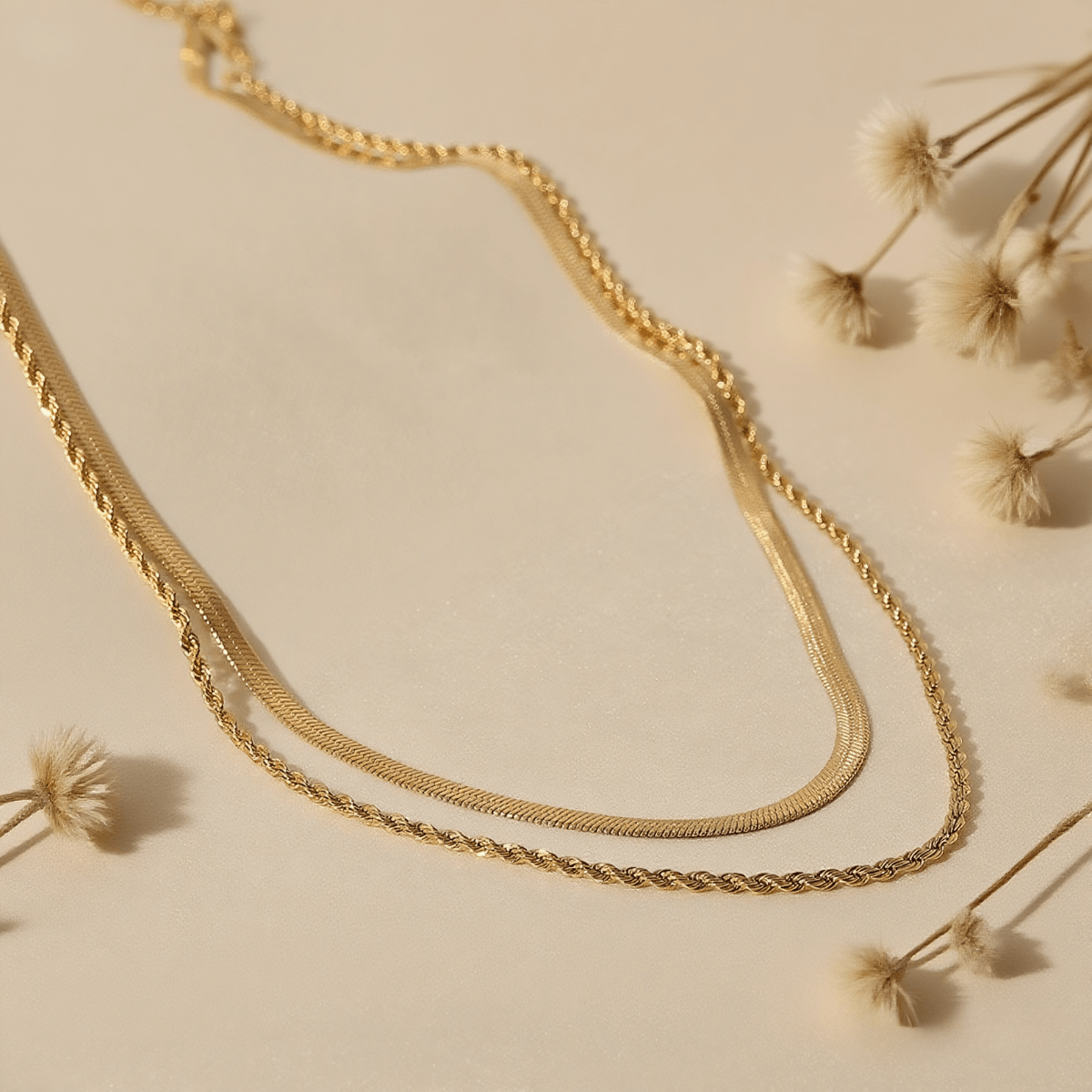Classic Layered Chain Necklace — two gold chains: sleek herringbone and rope style, 18K gold plated.