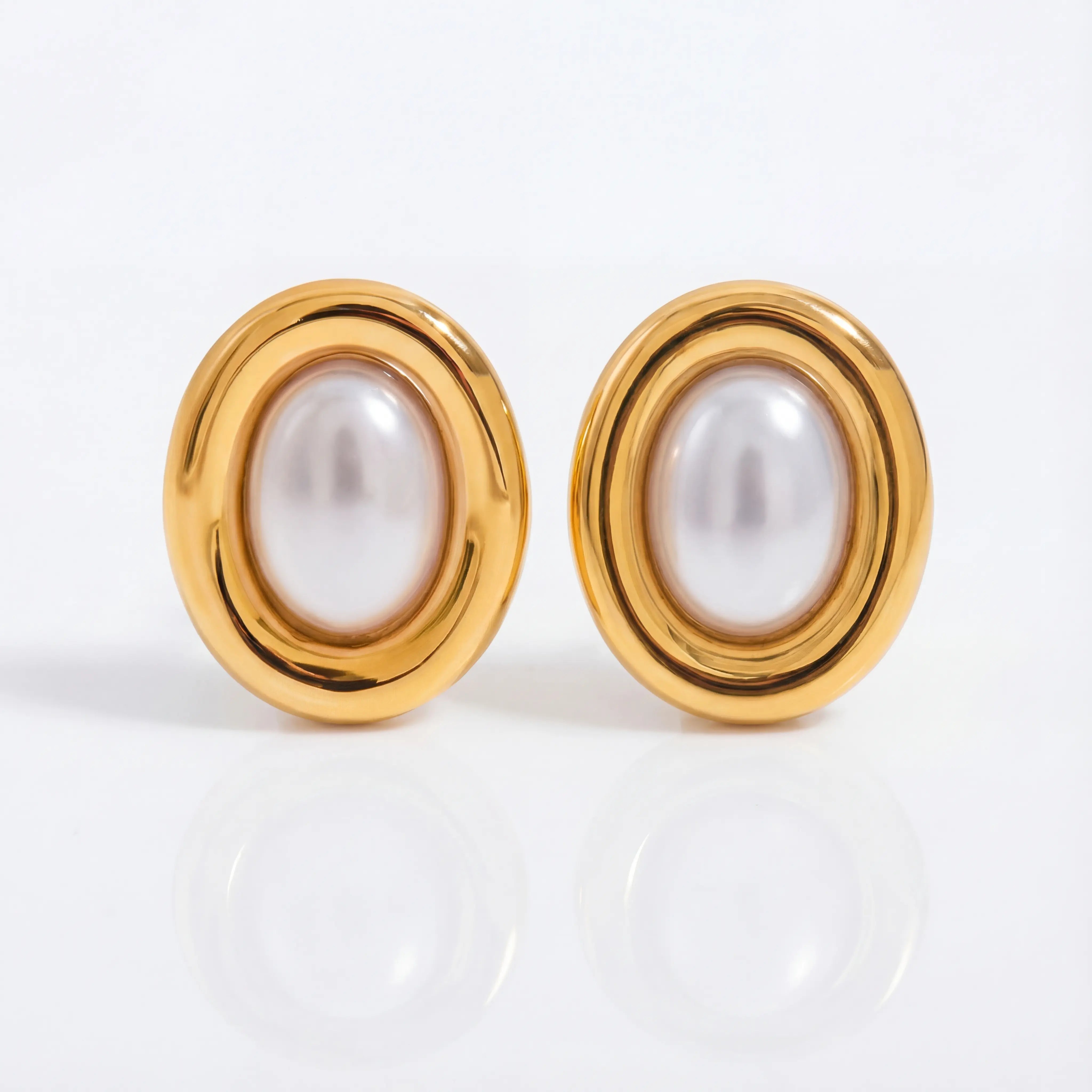 Pair of large oval stud earrings with white pearl center and thick gold rim waterproof.