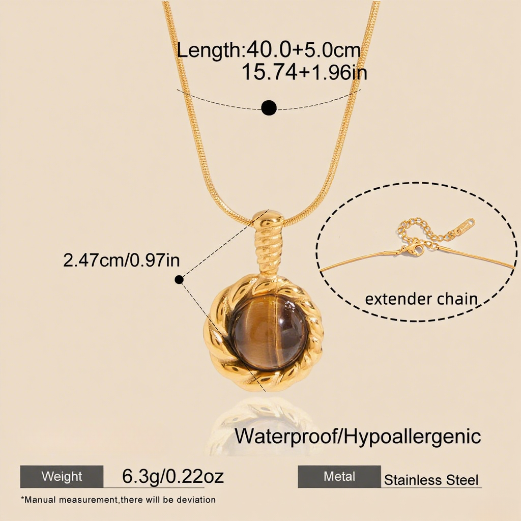 A macro shot of the rectangular Tiger's Eye pendant catching the light. The image details the captivating chatoyancy, showing the silky, golden-brown bands that shimmer and move as if alive.