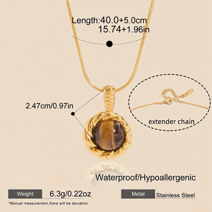 A macro shot of the rectangular Tiger's Eye pendant catching the light. The image details the captivating chatoyancy, showing the silky, golden-brown bands that shimmer and move as if alive.