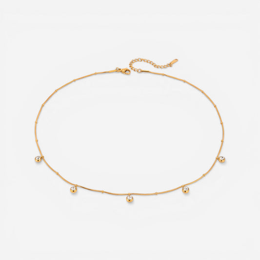 Gold delicate chain necklace with spaced out crystal bezel drops waterproof stainless steel.