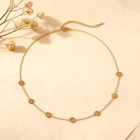 Luminova Dainty Bezel Station Gold Necklace with an empty setting, isolated on a white gold background.