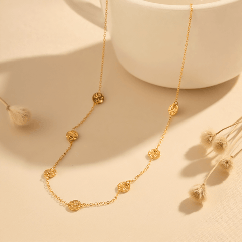 Luminova Dainty Bezel Station Gold Necklace with an empty setting, isolated on a white gold background.