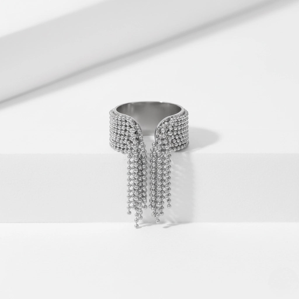 Silver fringe ring with dangling chains stainless steel statement piece.