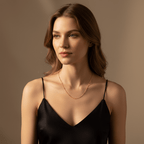 Woman wearing the Dotted Bead Chain Necklace alone as a minimalist choker with a black top.