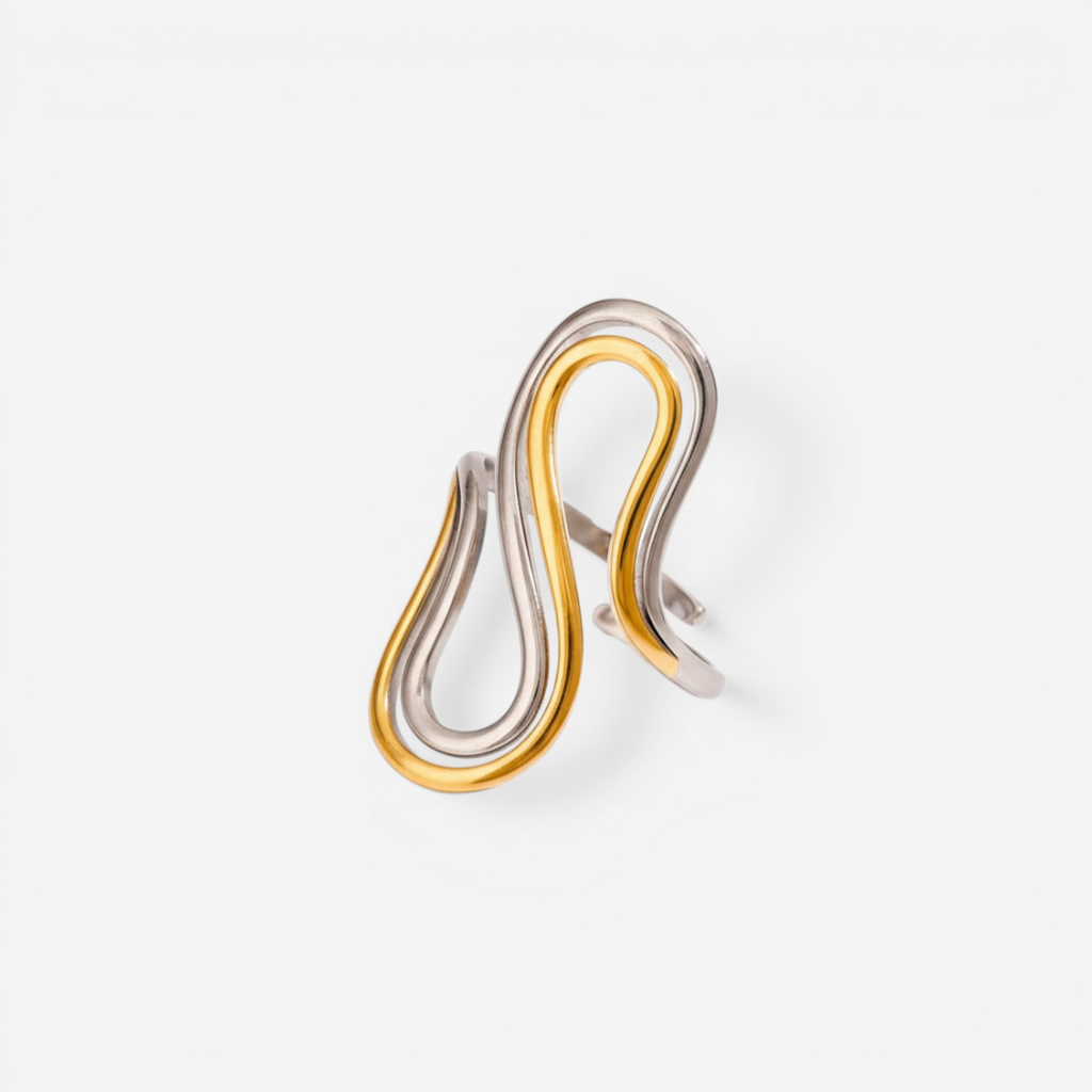 Mixed metal two-tone drift ring gold and silver sculptural band.