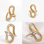 Aesthetic product photography of gold and two-tone sculptural rings on marble.